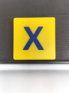 Article X - SCRABBLE JUNIOR